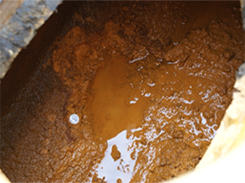 photo of scale and sludge from mining pipeline
